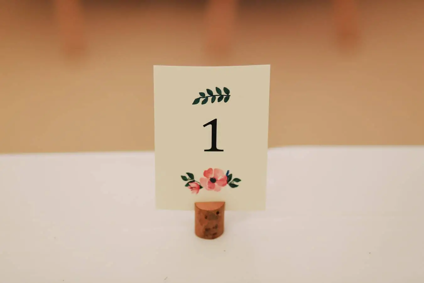 card with flower and number one on table
