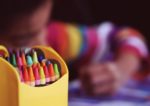 pre-school - child with crayons drawing
