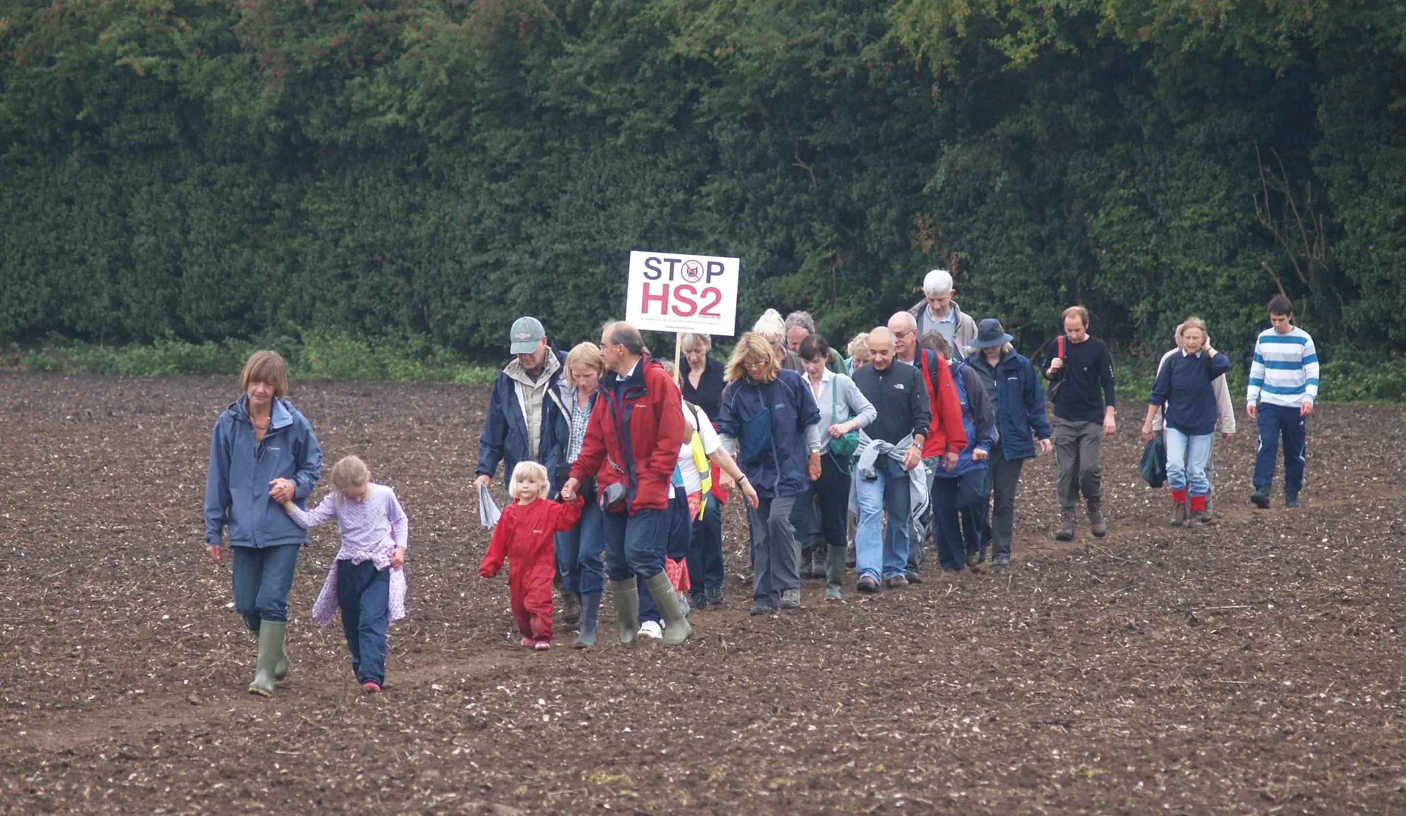 protest against HS2 - group of people walking across a field