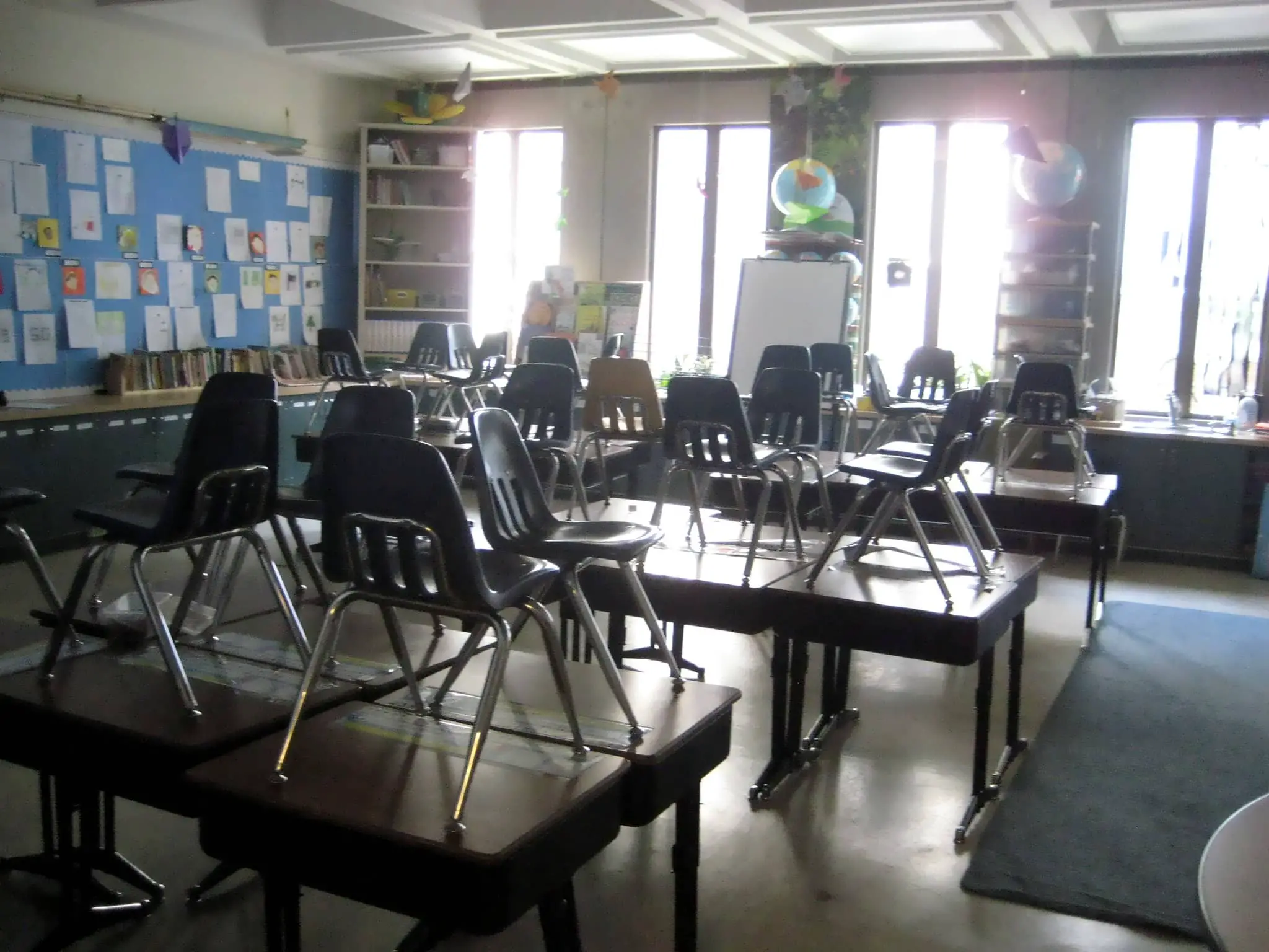 school classroom with chairs on desks