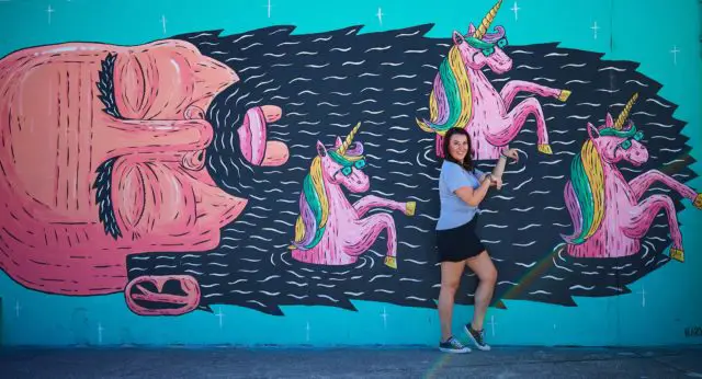 Lauren Ellingham and her Unicorn friends mural