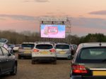 drive in film - cars parked for the screening