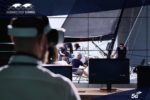 Person with VR headset watching sailing on screen