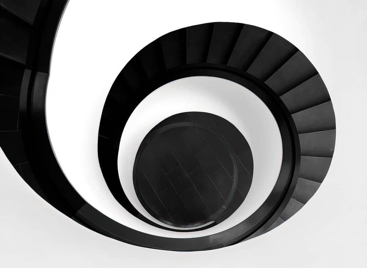 Looking down a spiral staircase by Robin Schreiner