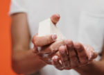 Man washing his hands with a bar of soap