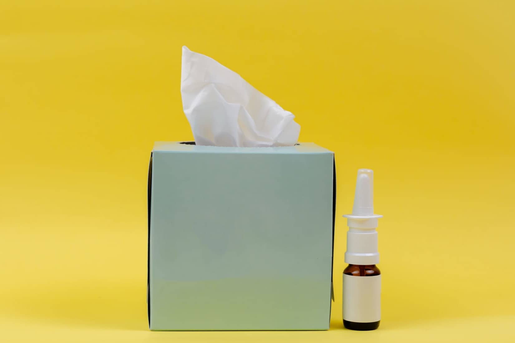 nasal spray and box of tissues