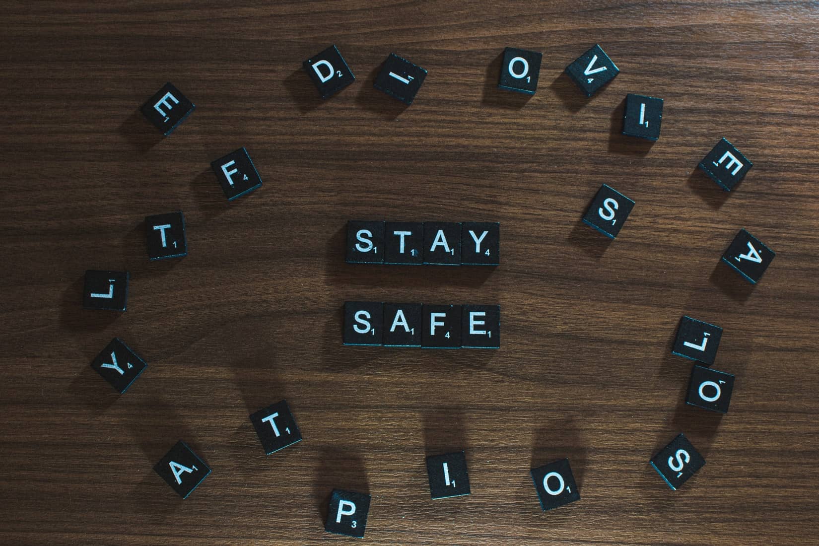 scrabble letters spelling out stay safe