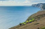 Coastguards dealing with the van over the cliff