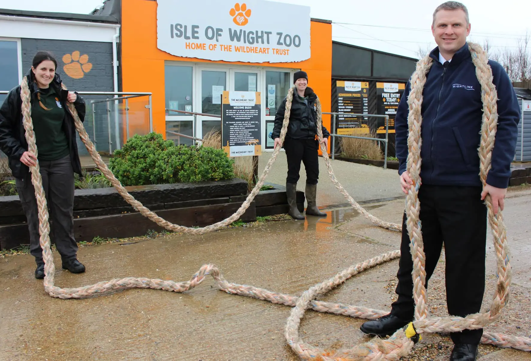 The long rope outside the zoo with zoo staff and wightlink member