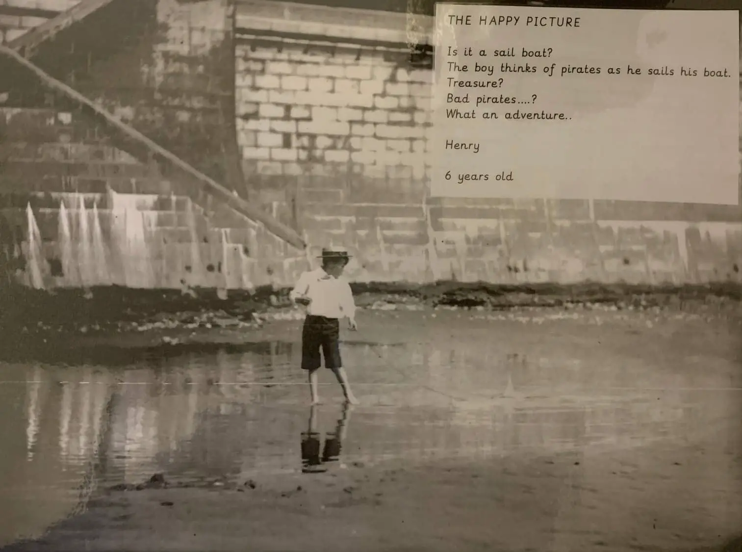 Boy on beach with St. T P Poem overlaid at side