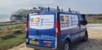 West Wight Men In Sheds Van with Freshwater Bay in the background