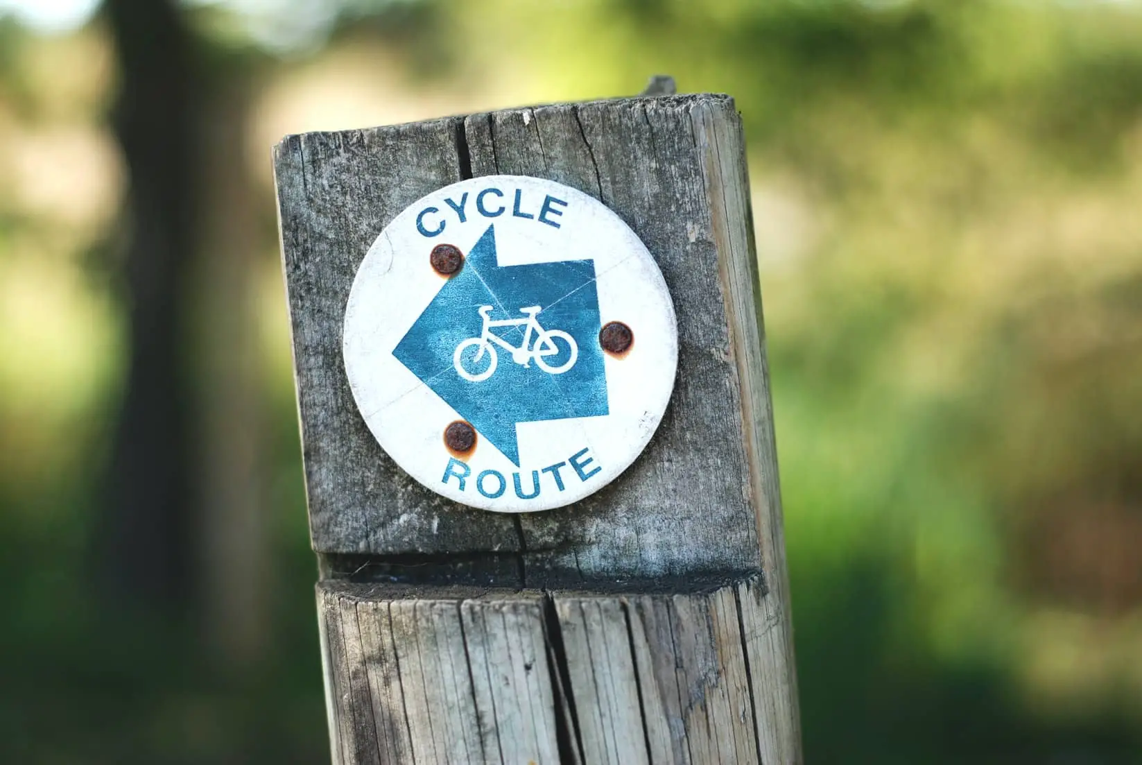 post with cycle path sign
