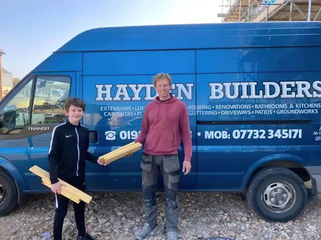 Liam collecting wood from Hayden Builders