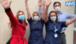 People waving thanks from NHS to volunteers