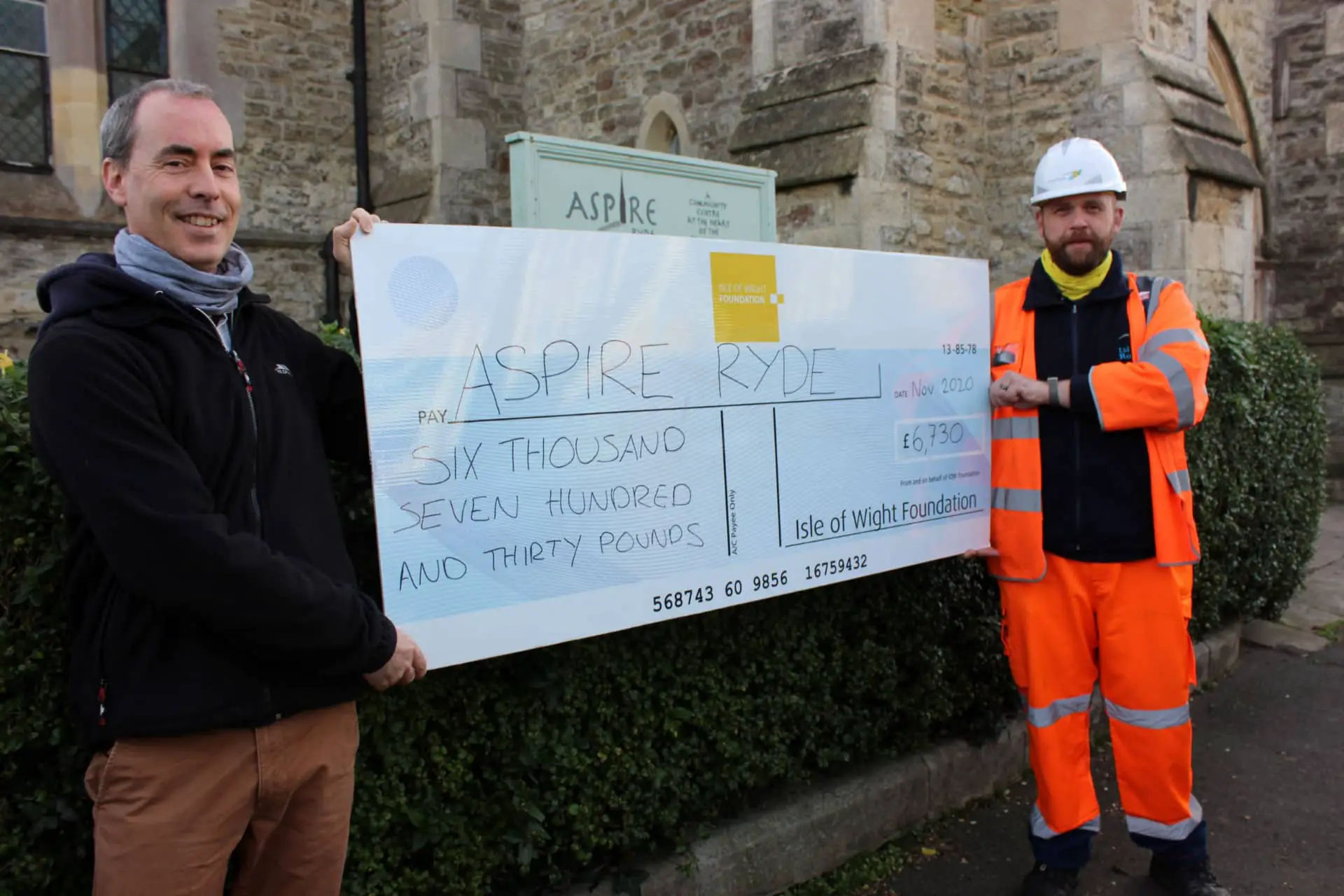 Cheque being presented to Aspire foundation with Seb Fry