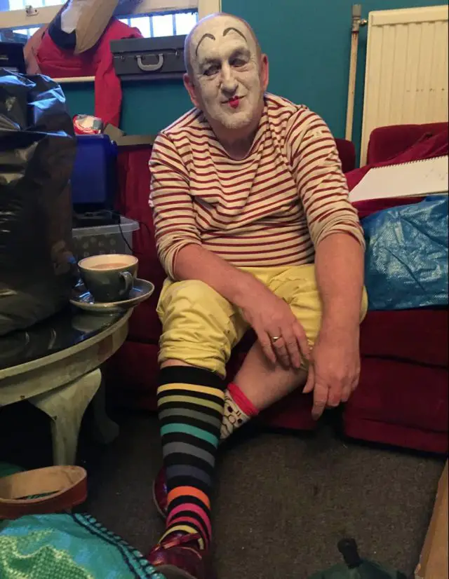 John Armstrong wearing face paint and stripy socks 