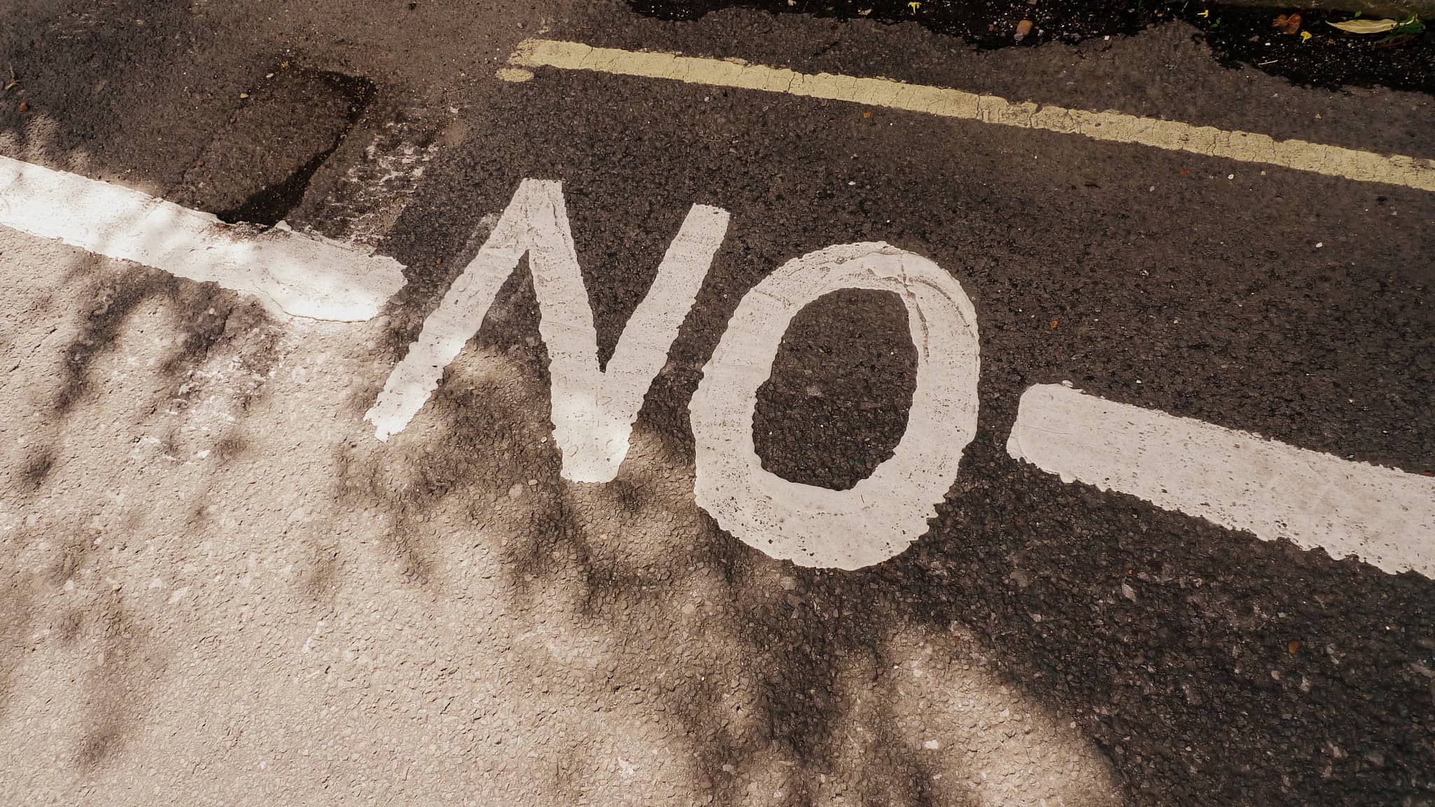 No written in white paint on road