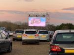 Movie Drive In with cars in front of screen