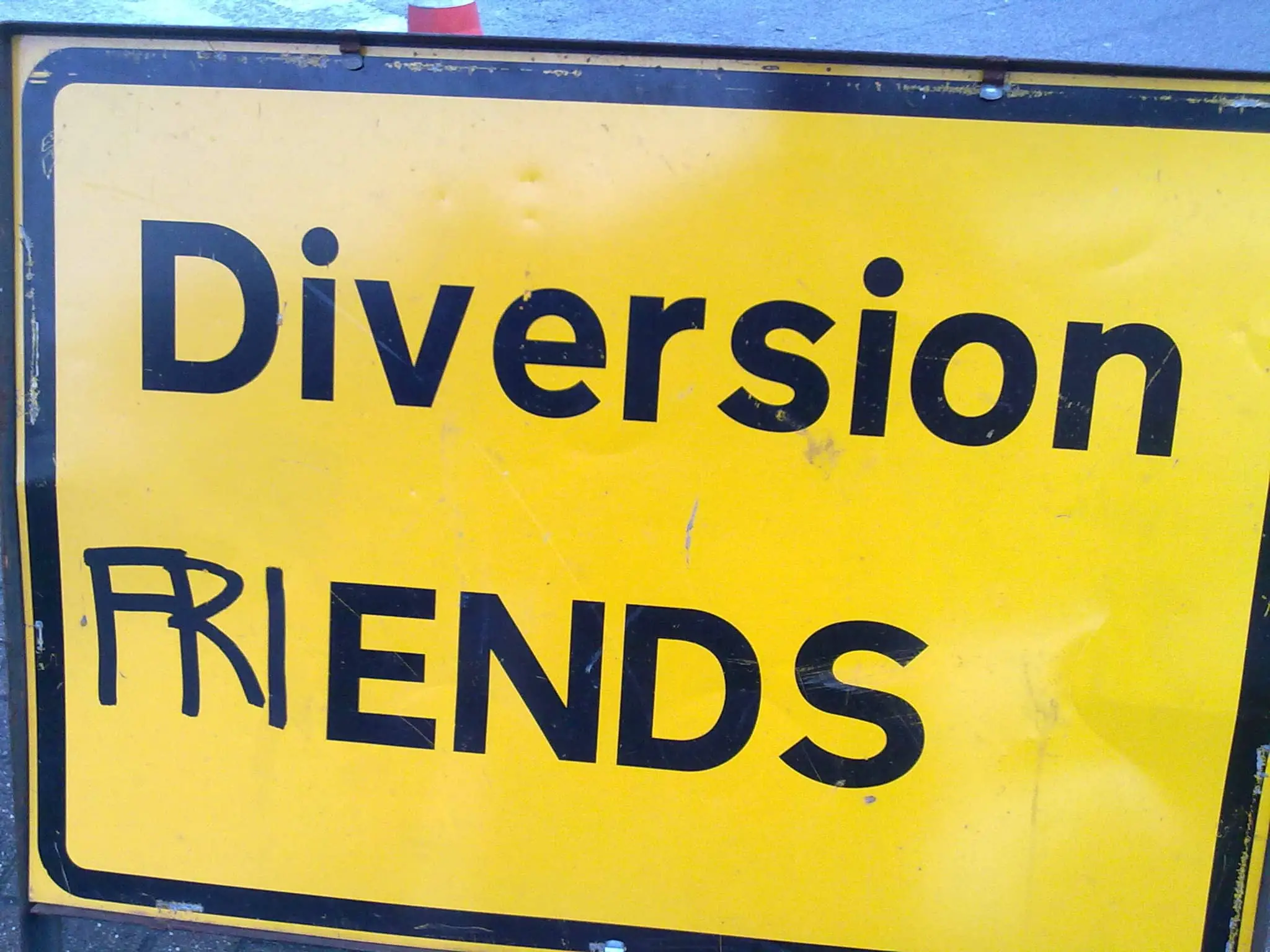 Diversion sign with 'fri' drawn on changing it into friends