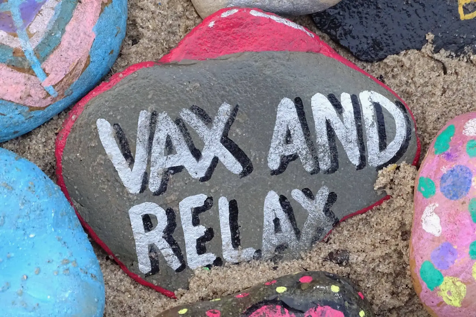 Pebble with vax and relax painted on to it