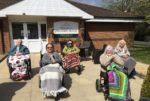 Residents wheelchair relay for Captain Sir Tom