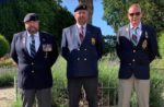Veterans in blazers with medals including Dale Hillier far right