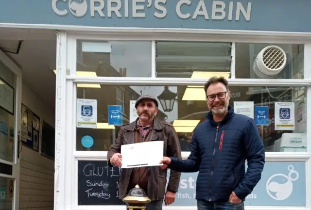 Steve Double with the Unison cheque at Corries Cabin with Richard Quigley