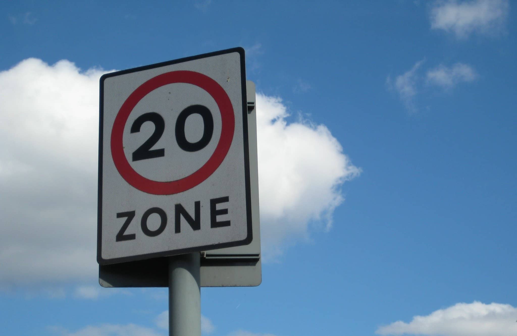 20mph zone sign with blue sky in background by edinburghgreens