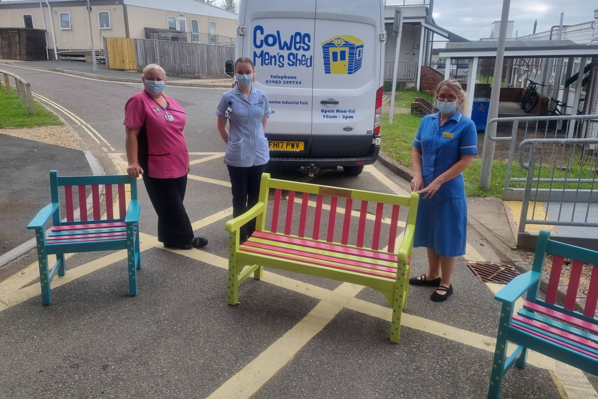 NHS Staff with benches outside hospital