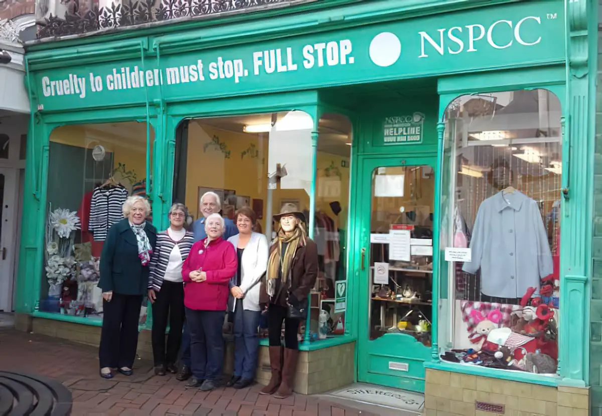 People standing outside Isle of Wight NSPCC charity shop in Cowes