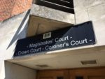 Magistrates court sign outside building