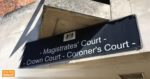 Magistrates court sign outside building with OTW flash