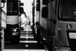 Rows of lorries HGVs on the road in black and white