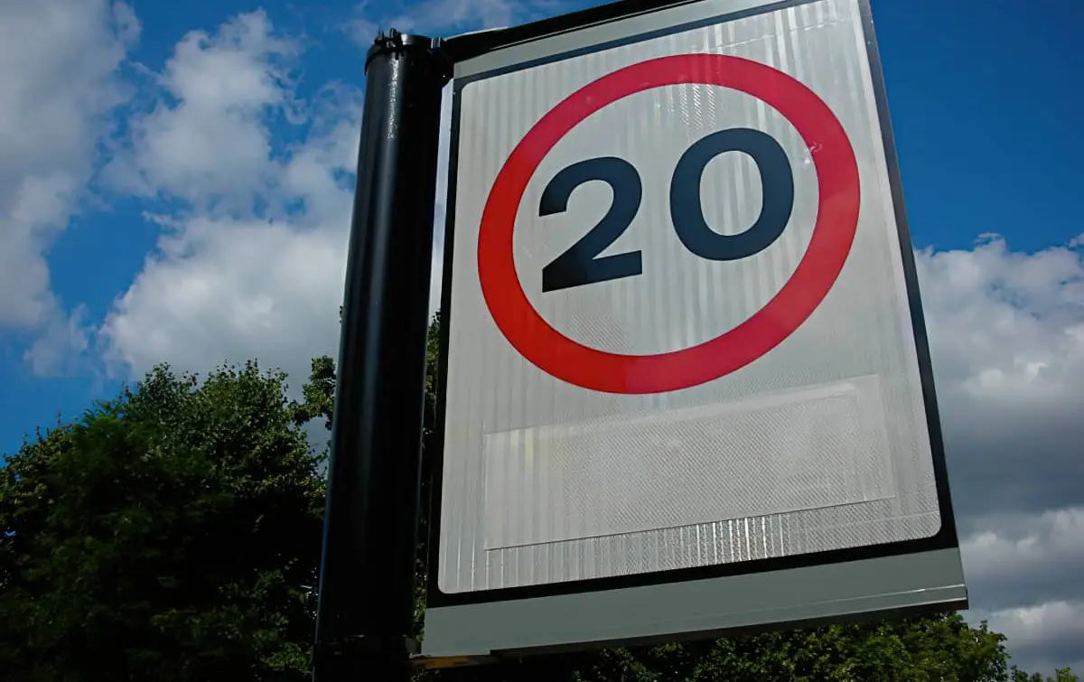 20mph sign with bushes and blue skies by anotherphotographer