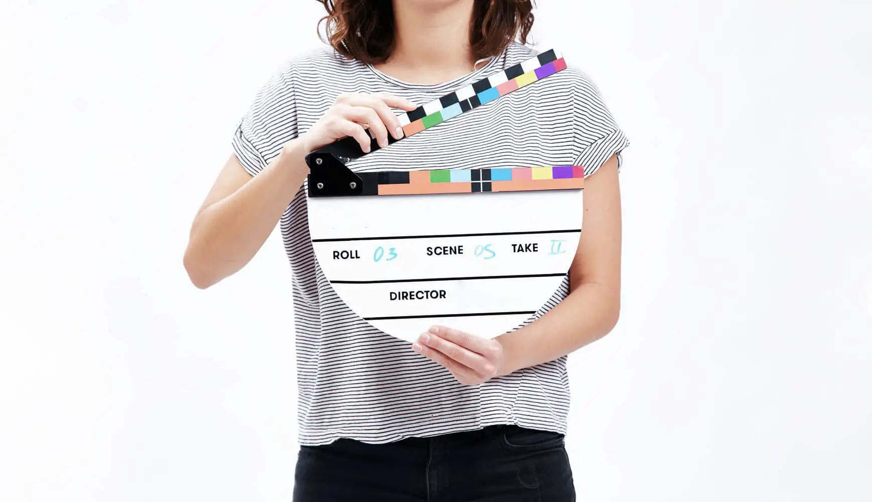 Young Woman holding a clapperboard