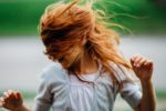 woman with red hair in windy conditions