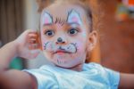 Child with face painted