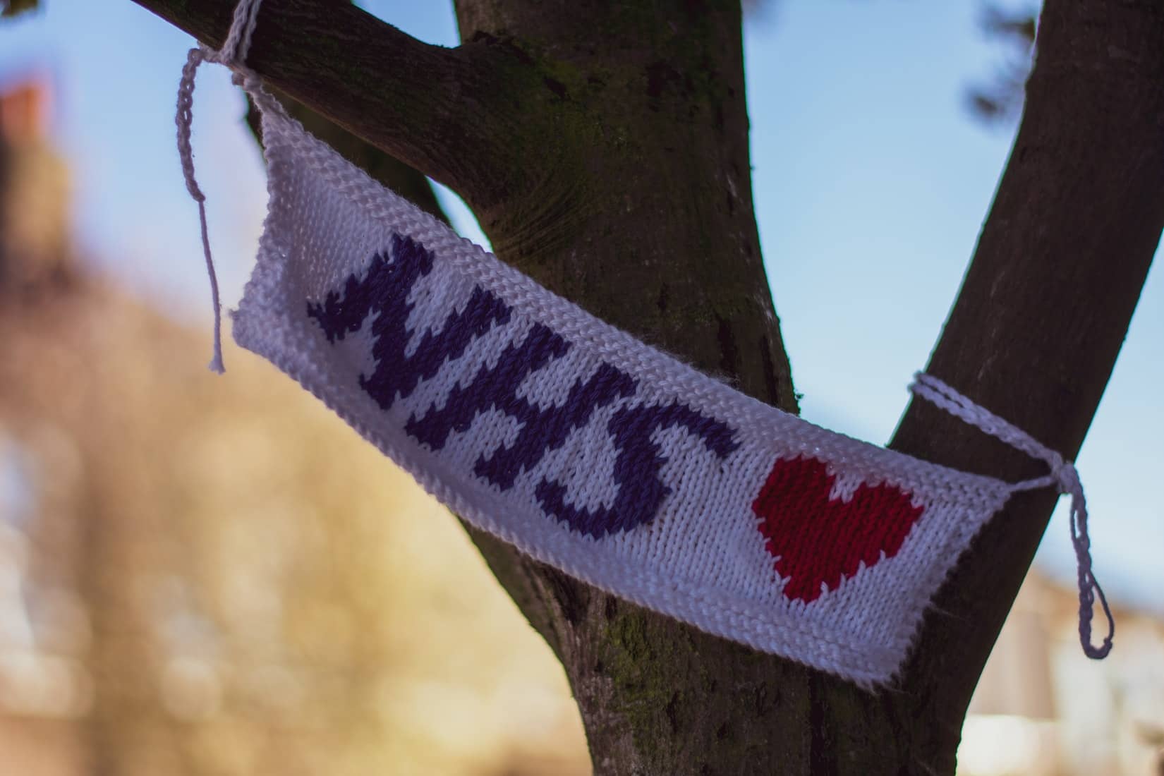 Knitted NHS banner in tree by Tugce Gungormezler