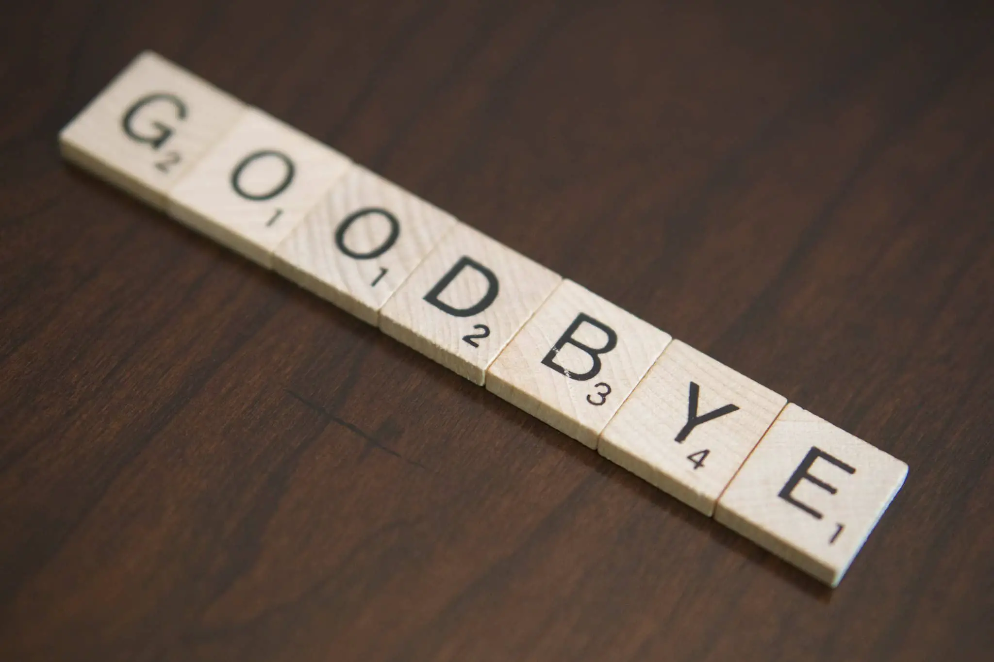 Scrabble letters spelling out Goodbye by Sharon Sinclair