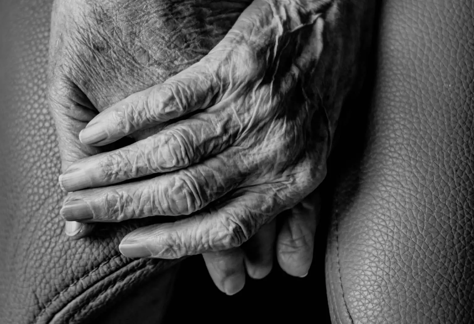 older people holding hands