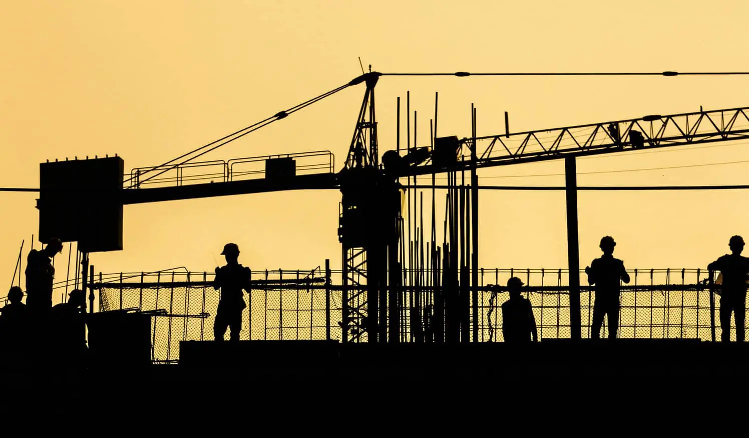 silhouette of construction workers