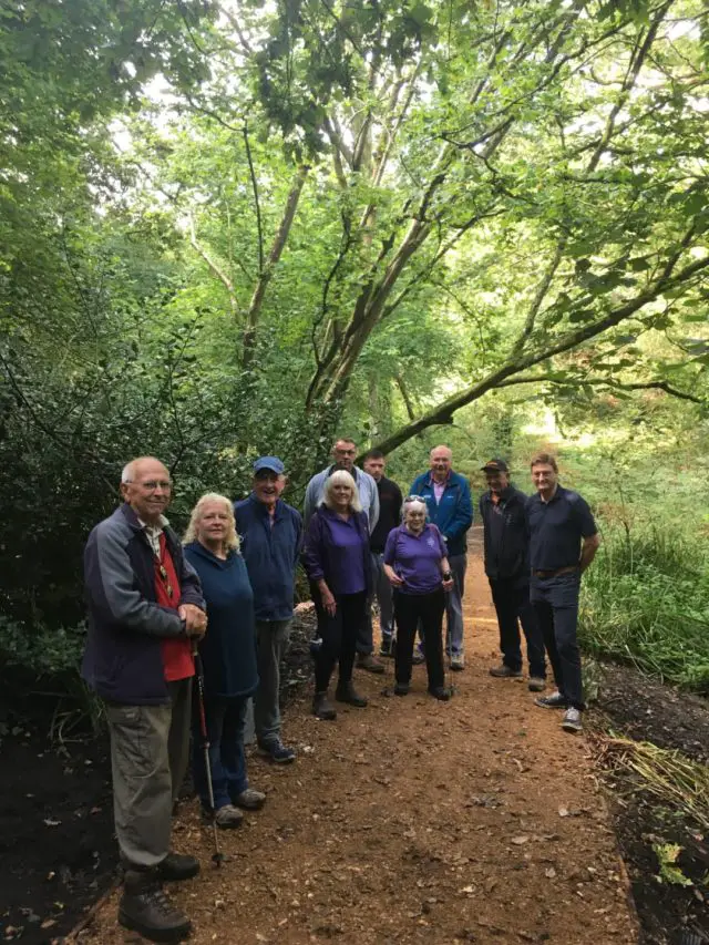 Celebrating the opening of the restored path at America Wood, Shanklin, are (from left to right): John Hague (Isle of Wight Ramblers Association), Carol Flux (Natural Enterprise), David Howarth (Isle of Wight Ramblers Association), Sheila Weedall (Isle of Wight Bridleways Group), Mark and Jack Taylor (Taylor and Taylor Groundworks), Tricia Merrifield (Isle of Wight Bridleways Group), Mike Slater (Isle of Wight Ramblers Association), Neil Morey and Darrel Clarke (Rights of Way team)
