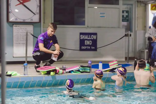 Instructor at Ryde Swimming Club talking to students