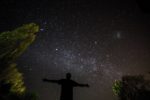 Silhouette of person stargazing