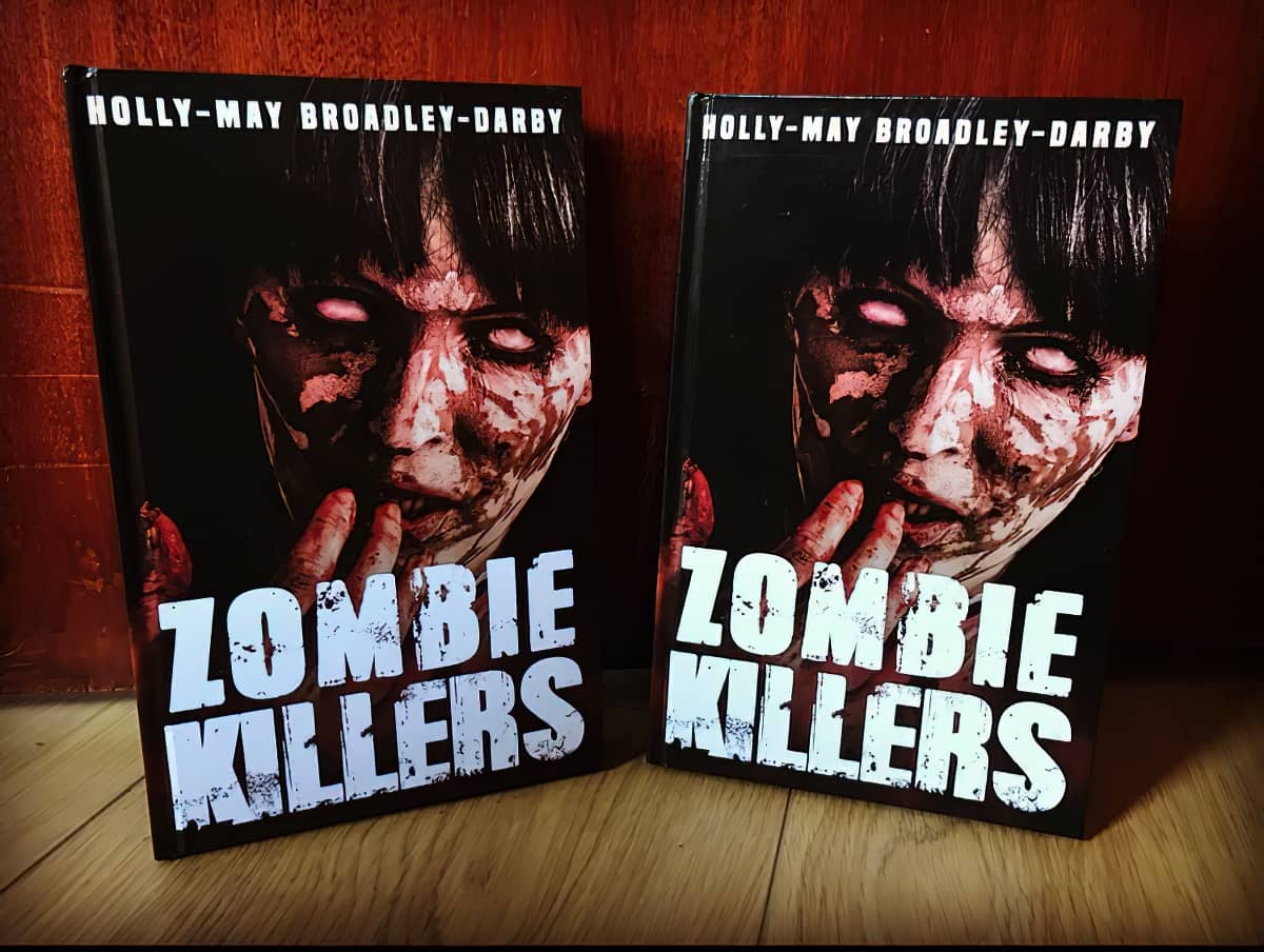 Two copies of Zombie Killers up against skirting board
