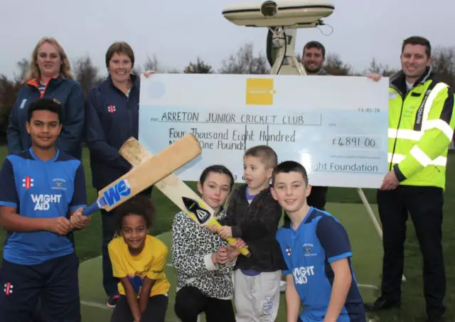 Arreton cricket club Jodie Blaize, Tina Cooper, Kevin Cooper, Jason Boulter with young members of Arreton Junior Cricket Club