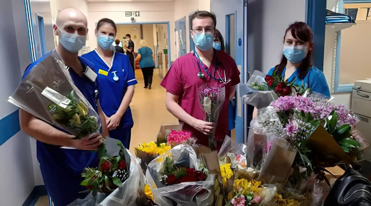 Staff in the emergency department receiving the flowers