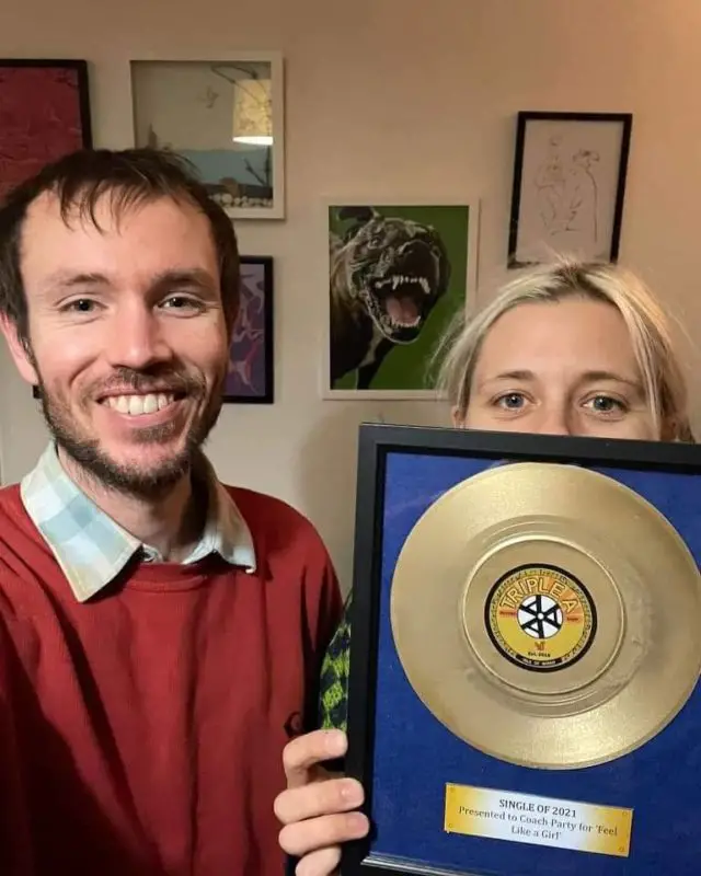 Coach Party band members Guy and Steph receiving their AAA Records Award
