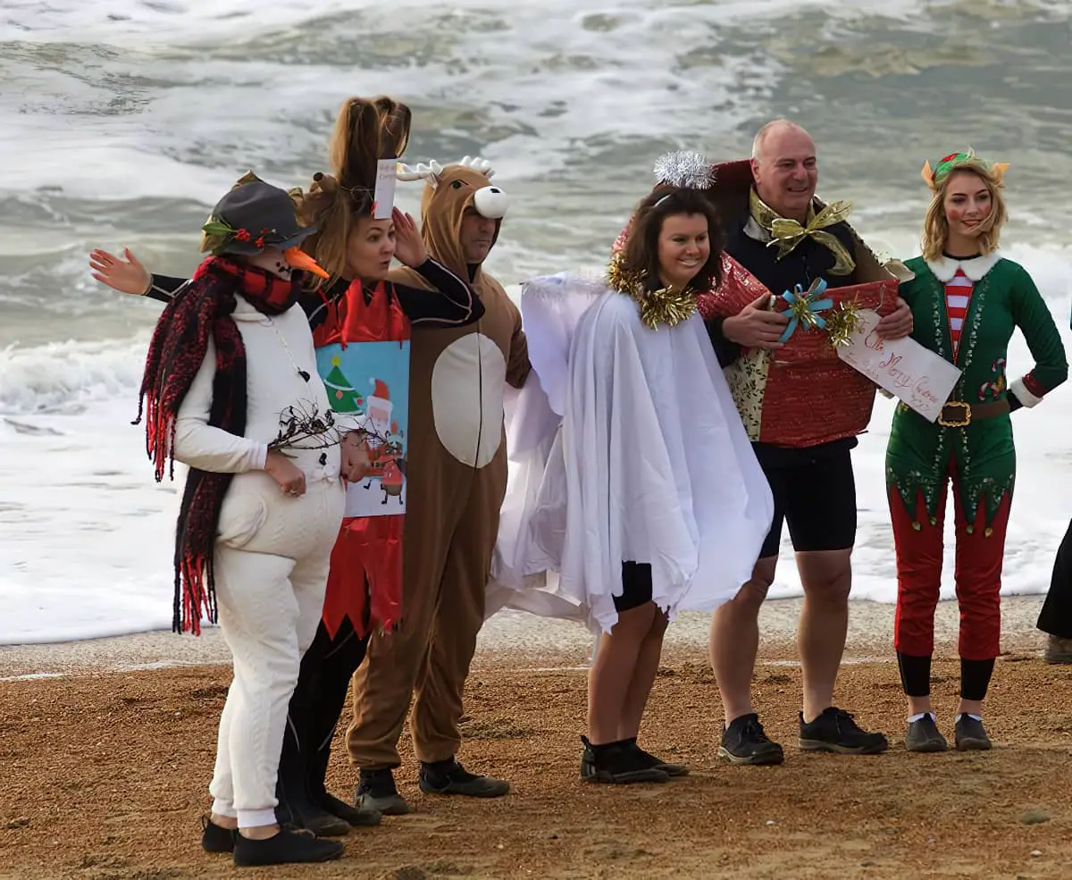 Dippers posing in fancy dress for Lesley Brown at 2017 Ventnor Boxing Day Swiim