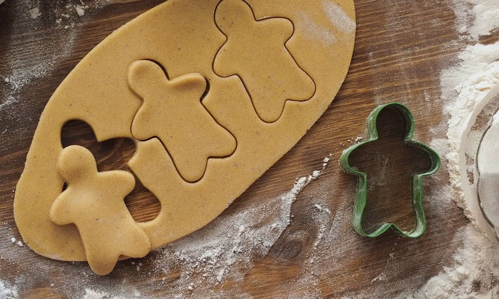 Gingerbread man being cut out of pastry